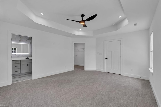 1 Lacrosse St, Hampton, VA 23663 - unfurnished bedroom with a tray ceiling, carpet, a spacious closet, baseboards, and recessed lighting