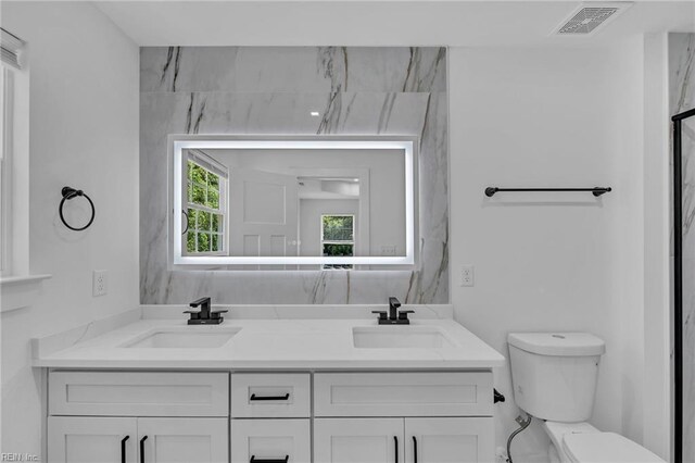 1 Lacrosse St, Hampton, VA 23663 - bathroom featuring toilet and double vanity