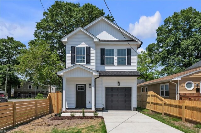 1 Lacrosse St, Hampton, VA 23663 - view of front of house featuring a garage, fence, concrete driveway, board and batten siding, and roof with shingles