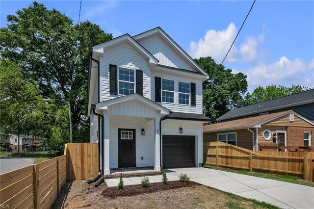 1 Lacrosse St, Hampton, VA 23663 - view of front facade with an attached garage, driveway, fence, and board and batten siding