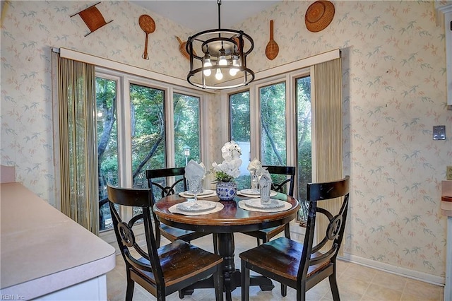 2029 Heron Ct, Suffolk, VA 23433 - dining area with a chandelier, wallpapered walls, baseboards, and light tile patterned floors
