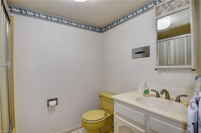 2029 Heron Ct, Suffolk, VA 23433 - bathroom featuring toilet, vanity, and wallpapered walls