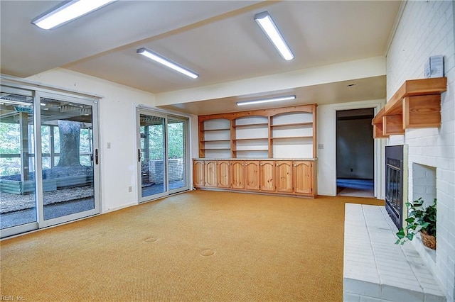 2029 Heron Ct, Suffolk, VA 23433 - unfurnished living room with a fireplace and light colored carpet