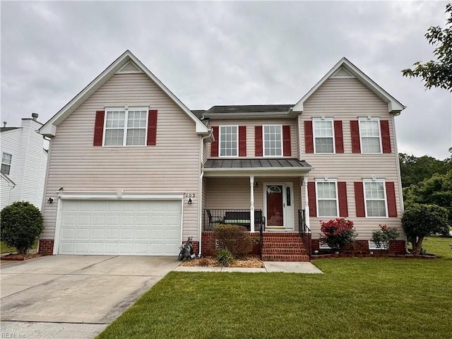 traditional-style home with a front yard, driveway, a garage, and covered porch