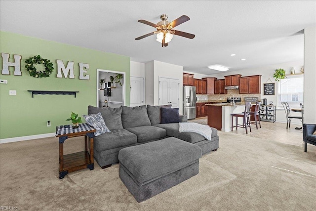 254 Mcpherson Rd, South Mills, NC 27976 - living area with a ceiling fan, baseboards, and light colored carpet