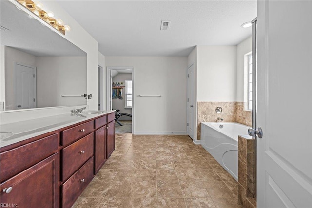 254 Mcpherson Rd, South Mills, NC 27976 - full bath with a bath, double vanity, and baseboards