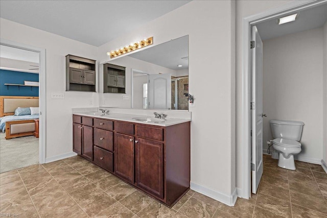 254 Mcpherson Rd, South Mills, NC 27976 - bathroom with baseboards, double vanity, toilet, a stall shower, and ensuite bathroom