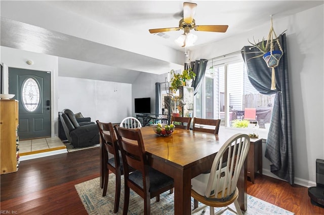 dining space with wood finished floors and ceiling fan