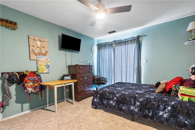 bedroom with carpet flooring, baseboards, and ceiling fan