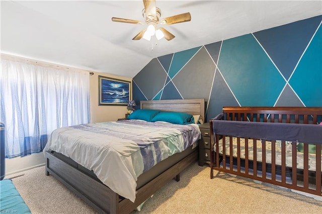 bedroom with carpet floors, lofted ceiling, and ceiling fan