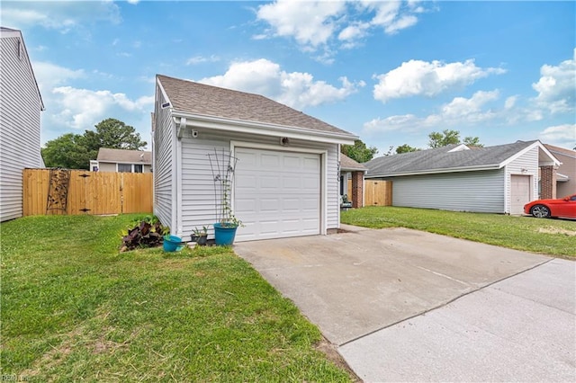 garage featuring driveway and a gate