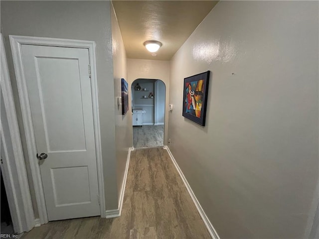 220 Chesterfield Rd, Hampton, VA 23661 - corridor with wood finished floors, arched walkways, and baseboards
