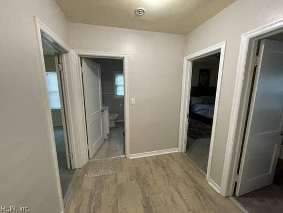 220 Chesterfield Rd, Hampton, VA 23661 - corridor featuring wood finished floors and baseboards