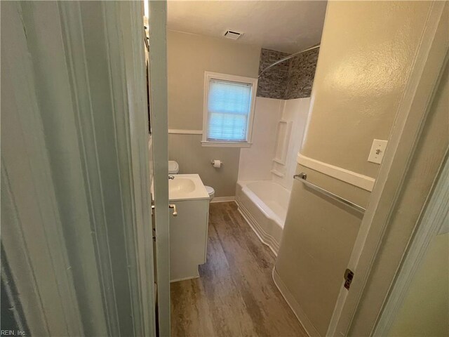 220 Chesterfield Rd, Hampton, VA 23661 - full bath featuring wood finished floors, vanity, toilet, and shower / bathtub combination