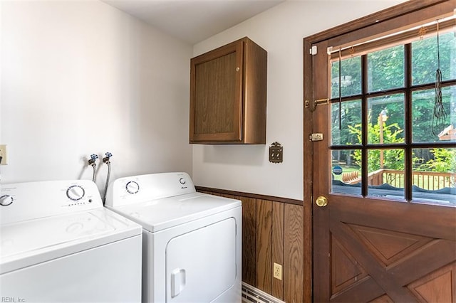 205 Shackleford Rd, Yorktown, VA 23693 - laundry area with cabinet space, washing machine and clothes dryer, wainscoting, and wooden walls