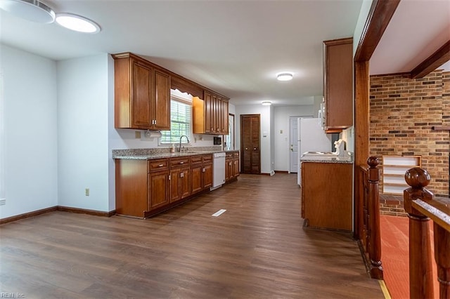 205 Shackleford Rd, Yorktown, VA 23693 - kitchen with white dishwasher, dark wood-type flooring, a sink, and brown cabinets
