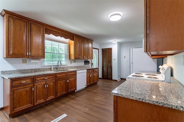 205 Shackleford Rd, Yorktown, VA 23693 - kitchen featuring white appliances, a sink, dark wood-style flooring, and brown cabinetry
