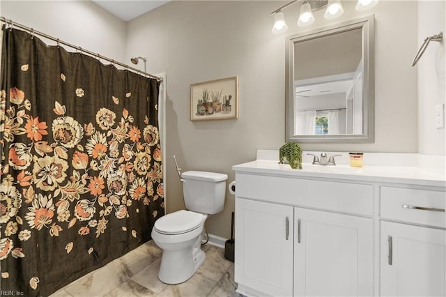 full bath featuring toilet, vanity, and a shower with shower curtain