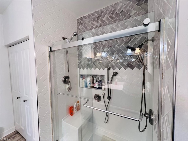 bathroom featuring a shower stall