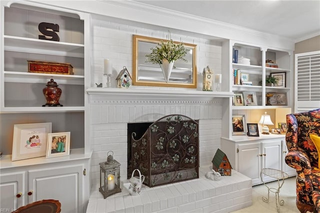 living area with a fireplace and crown molding