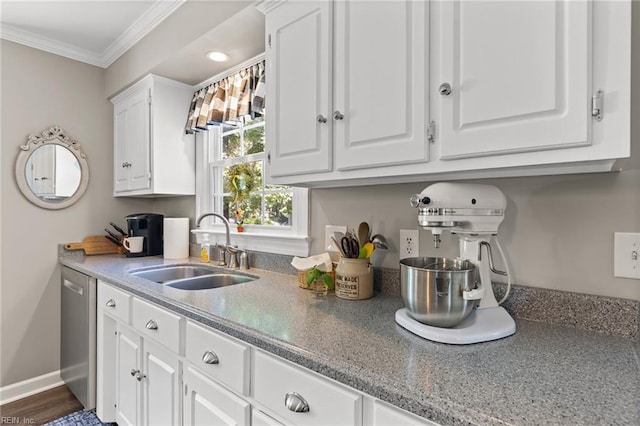 kitchen featuring a sink, white cabinetry, crown molding, stainless steel dishwasher, and baseboards