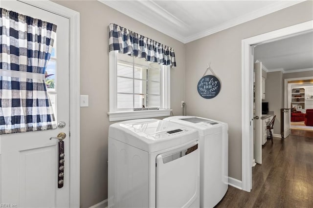 laundry area featuring independent washer and dryer, crown molding, dark wood-style flooring, and baseboards