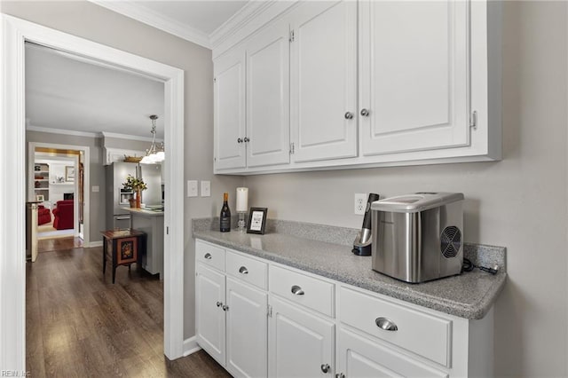 bar with crown molding, stainless steel fridge with ice dispenser, dark wood-type flooring, and baseboards