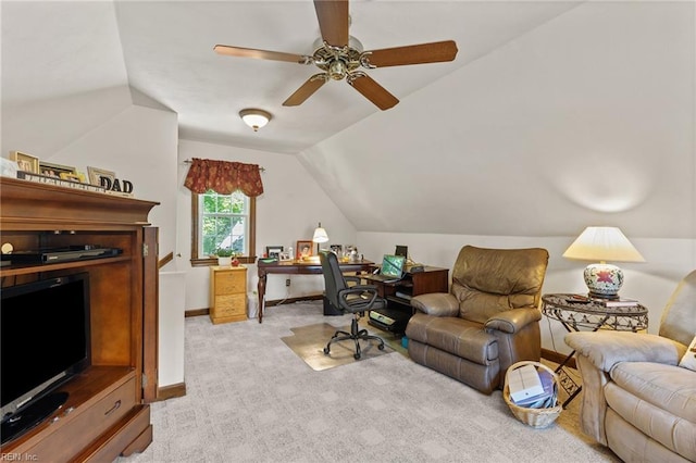 home office with light carpet, lofted ceiling, a ceiling fan, and baseboards