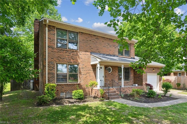 view of front of home featuring a garage, brick siding, and driveway