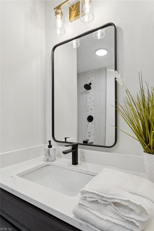 bathroom featuring vanity and a shower