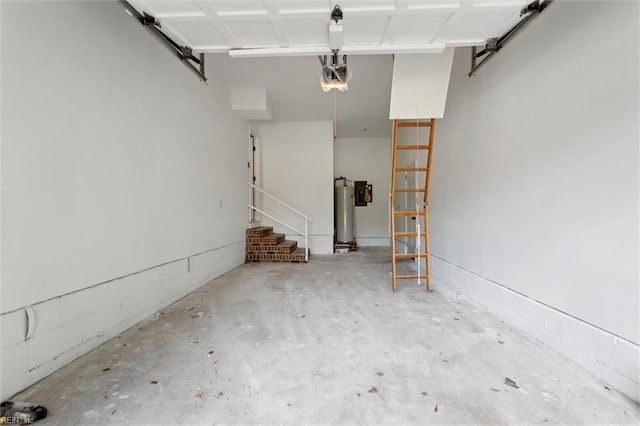 garage with gas water heater and a garage door opener
