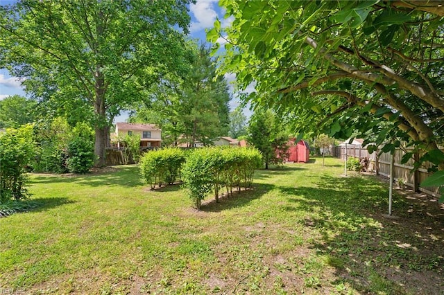 view of yard with an outdoor structure and a storage shed