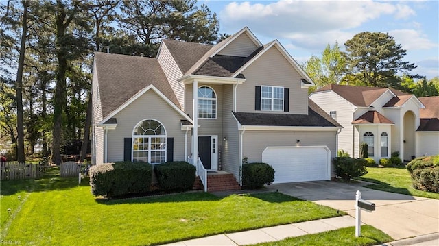 6738 Burbage Landing Cir, Suffolk, VA 23435 - traditional-style home with driveway, a front lawn, and roof with shingles