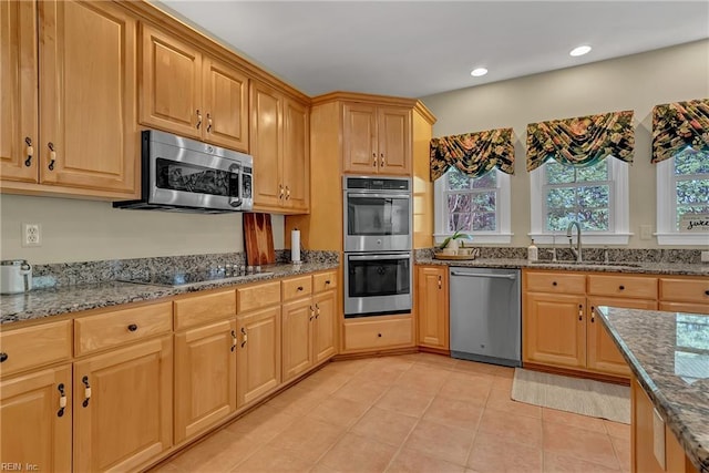 5302 Marsh Landing Ln, Suffolk, VA 23435 - kitchen featuring stainless steel appliances, a sink, dark stone counters, light tile patterned flooring, and recessed lighting