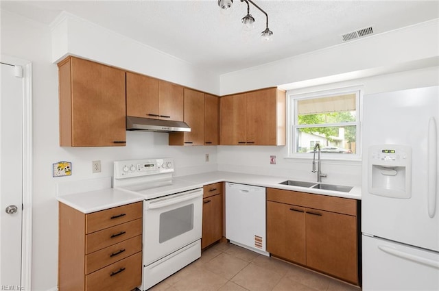 13024 Green Grove Ln, Newport News, VA 23608 - kitchen with white appliances, under cabinet range hood, a sink, light countertops, and brown cabinets