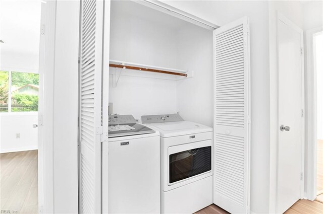 13024 Green Grove Ln, Newport News, VA 23608 - washroom featuring light wood-type flooring, separate washer and dryer, and baseboards
