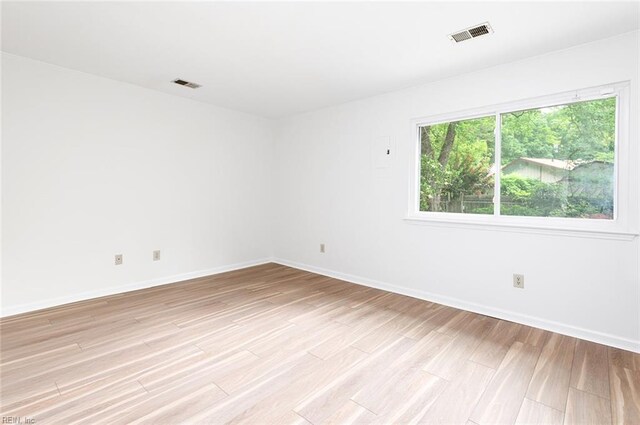 13024 Green Grove Ln, Newport News, VA 23608 - unfurnished room with light wood finished floors and baseboards