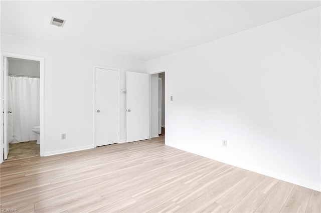 13024 Green Grove Ln, Newport News, VA 23608 - unfurnished bedroom featuring light wood finished floors and connected bathroom