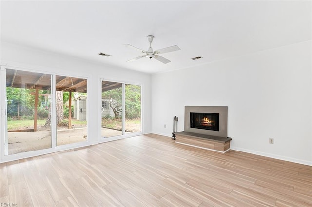 13024 Green Grove Ln, Newport News, VA 23608 - unfurnished living room featuring a ceiling fan, light wood-style flooring, baseboards, and a glass covered fireplace