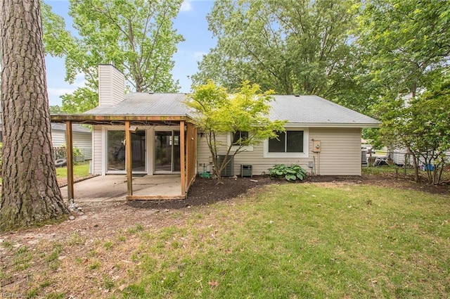 13024 Green Grove Ln, Newport News, VA 23608 - back of property with a patio area, a chimney, a carport, and central AC