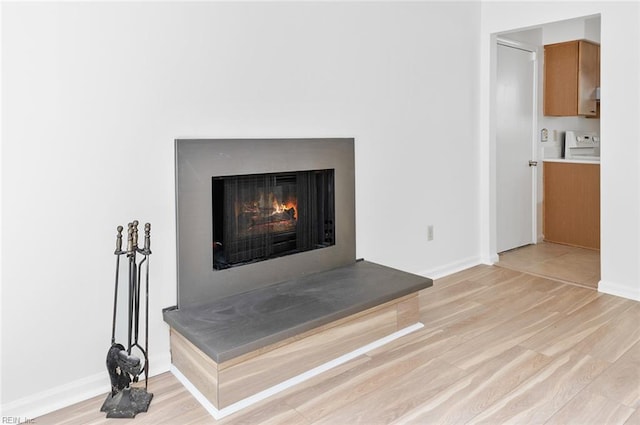 13024 Green Grove Ln, Newport News, VA 23608 - detailed view of wood finished floors, a lit fireplace, range, and baseboards