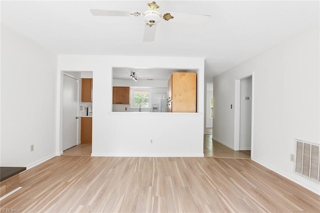 13024 Green Grove Ln, Newport News, VA 23608 - unfurnished living room featuring light wood-style floors, ceiling fan, and baseboards