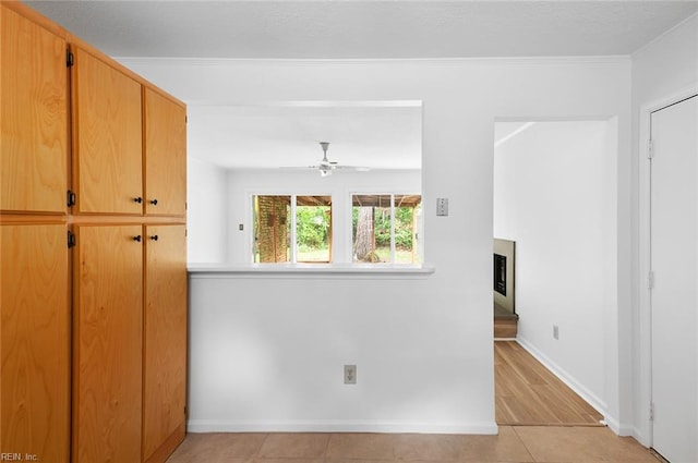 13024 Green Grove Ln, Newport News, VA 23608 - unfurnished room featuring a ceiling fan, crown molding, baseboards, and light tile patterned floors