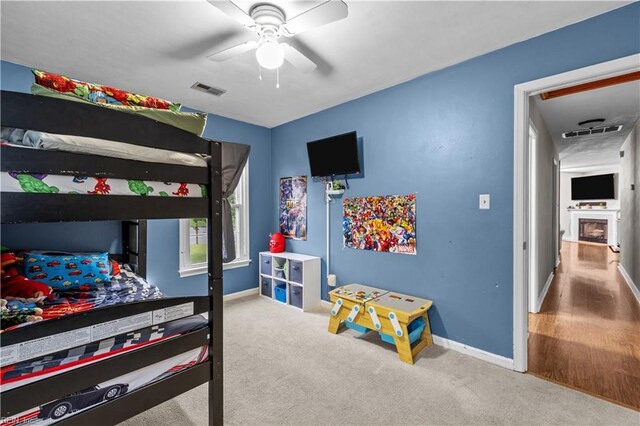 3412 Winterhawk Ct, Chesapeake, VA 23323 - bedroom featuring baseboards, carpet floors, ceiling fan, and a fireplace
