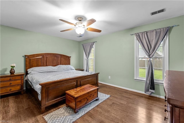 3412 Winterhawk Ct, Chesapeake, VA 23323 - bedroom with dark wood-type flooring, multiple windows, and baseboards
