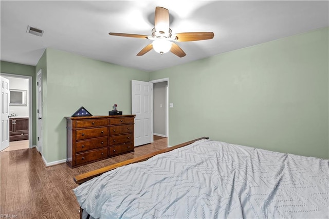 3412 Winterhawk Ct, Chesapeake, VA 23323 - bedroom featuring wood finished floors, baseboards, ceiling fan, and ensuite bathroom