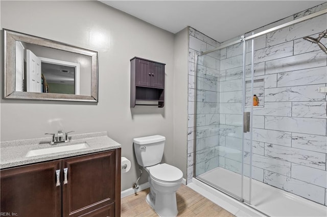 3412 Winterhawk Ct, Chesapeake, VA 23323 - full bathroom featuring a stall shower, toilet, vanity, wood finished floors, and baseboards
