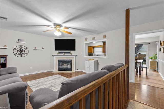 3412 Winterhawk Ct, Chesapeake, VA 23323 - living room with a ceiling fan, wood finished floors, baseboards, and a fireplace with flush hearth