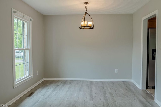 100 Woodland Cir, Franklin, VA 23851 - unfurnished room with plenty of natural light, light wood-type flooring, and baseboards