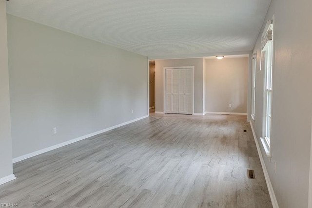 100 Woodland Cir, Franklin, VA 23851 - empty room with wood finished floors and baseboards